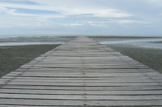 Old wood bridge on the sea
