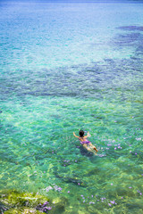 Naklejka na ściany i meble Young woman swimming in Ky Co beach