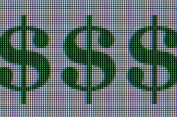 Macro shot of three dollar signs on computer screen