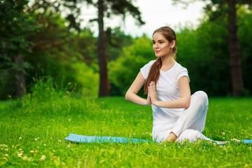 Young women doing yoga outdoor