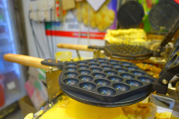 Delicious street food in the streets of Asia, Hong Kong, China, in a blurred background