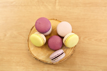 different macarons on wooden stand