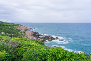 Obraz premium The coastline with the cliff and the rock in Cu Lao Xanh island Qui Nhon Vietnam