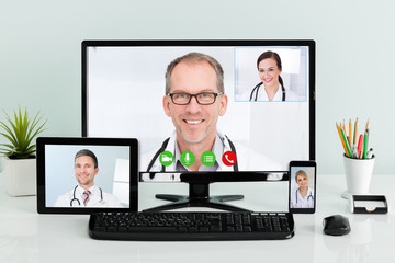 Doctors Having Conference Call At Hospital