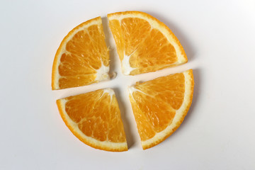 Fototapeta na wymiar Orange cut into 4 slices isolate close-up