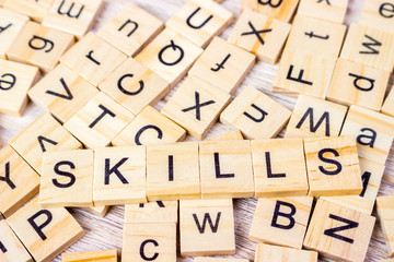 Skills Word Written In Wooden Cube. Wooden Cube Background