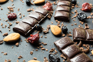 Sweet black chocolate and dried fruits with nuts.