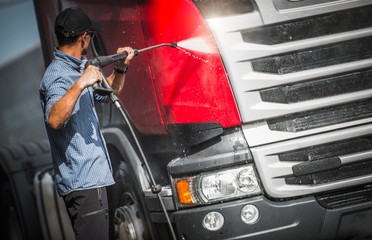 Truck Driver Washing His Semi