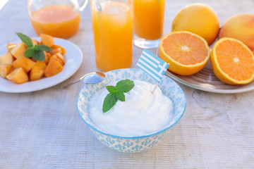Healthy breakfast concept yogurt, fruits, fresh juice.
