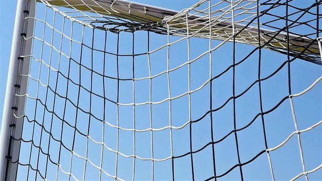 Slow motion of football soccer ball goal into net