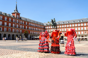 sevillana traditional dress at madrid plaza mayor, spain