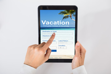 Businessperson Filling Online Vacation Form On Digital Tablet