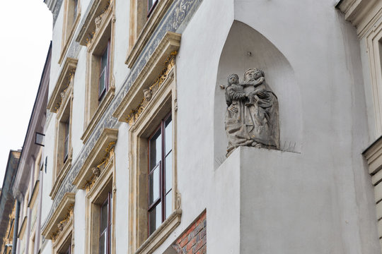 Wall religious sculpture closeup in Warsaw, Poland.