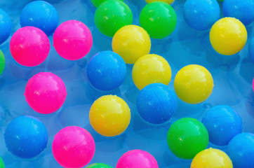 Fototapeta na wymiar Some plastic balls in a pool