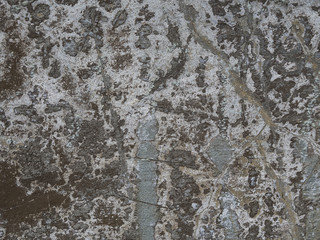 old painted peeling multi colour chapped plaster facade