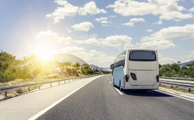 Foto op Plexiglas Bus rushes along the asphalt high-speed highway. © Denis Rozhnovsky