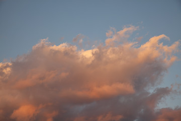 Naklejka na ściany i meble Dramatic clouds at the sunset