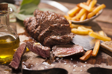 Delicious beef steakes on wood