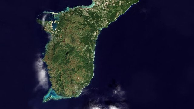 Very high-altitude overflight aerial of Guam. Clip loops and is reversible. Elements of this image furnished by USGS/NASA Landsat