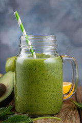 Smoothies of avocado, banana, citrus and spinach leaves. Closeup