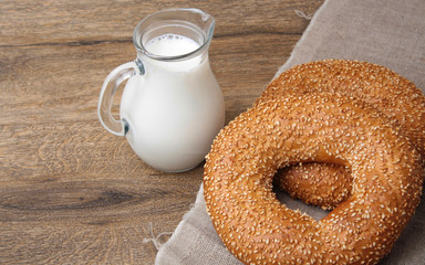 bagel with sesame seeds and milk
