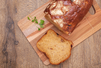 Sliced black bread on the wooden plank