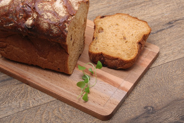 Sliced black bread on the wooden plank