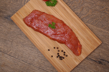 Pork neck slices on a plate