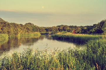 Naklejka na ściany i meble Photo with a river on a clear summer day, landscape