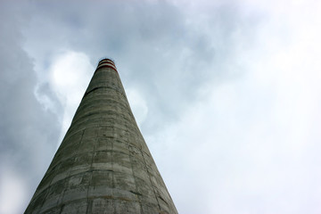 Industrial chimney emit toxic pollutants in the sky, polluting the environment