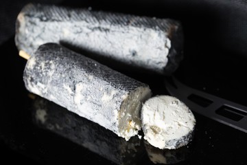 Studio shot of french goat cheese Saint Maure