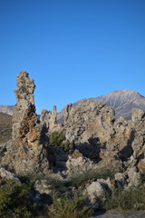 Fototapeta premium Big Blue Sky and Tufa Structures, with mountains in the background
