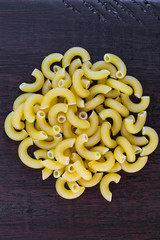 Elbow macaroni wood background