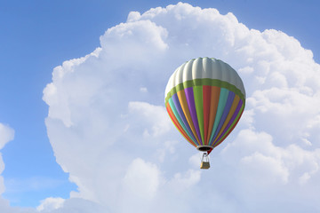 Aerostat floating in day sky. Mixed media