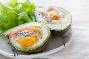 Baked smoked salmon, egg in avodaco, ketogenic keto low carb diet, gluten free healthy food