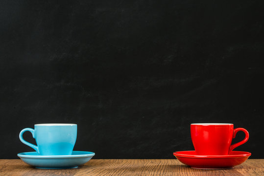 blue and red coffee cups with plates arrangement