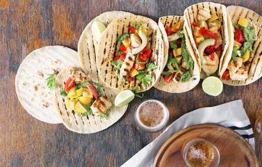 Corn tortillas with grilled chicken fillet, guacamole sauce and beer