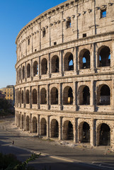 Fototapeta premium Rome, Italy - The archeological ruins with Colosseum in historic center of Rome, named Imperial Fora, in a sunday morning.