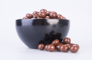 chocolate balls. chocolate balls in bowl on a background