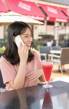 Chinese girl calling in cafe