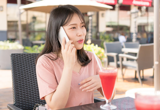 Chinese girl calling in cafe
