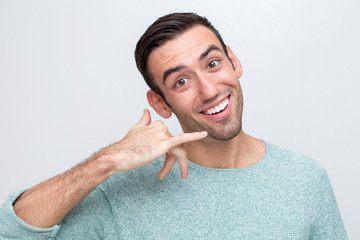 Closeup of Friendly Man Making Call me Gesture
