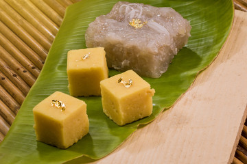 Thai home made traditional sweets. Banana Treat served with Coconut Peanut Cake