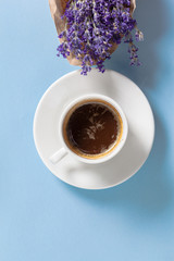 Obraz na płótnie Canvas Coffee with flowers composition on the table