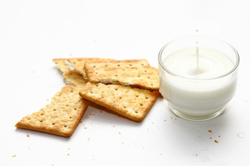 A cracker is a baked food typically made from flour. Flavorings or seasonings, such as salt, herbs, seeds, and/or cheese, may be added to the dough or sprinkled on top before baking