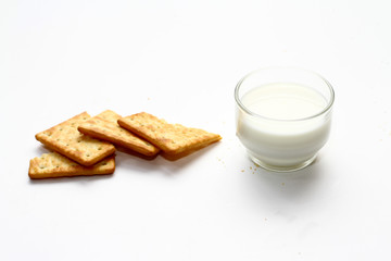 A cracker is a baked food typically made from flour. Flavorings or seasonings, such as salt, herbs, seeds, and/or cheese, may be added to the dough or sprinkled on top before baking