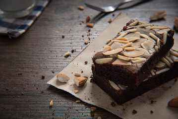 Chocolate Almond Brownie on the wood table has ready to served.