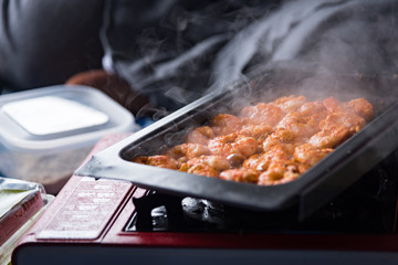 Shrimp was cooking on pan with smoke.