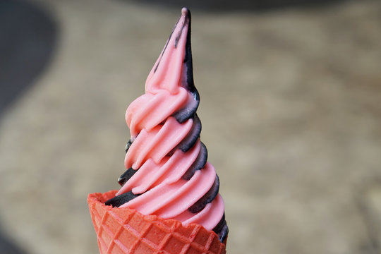 Closeup Cone Of Mixed Frozen Yogurt Charcoal And Strawberry (Soft Serve Ice Cream), Premium Milk Low Fat.