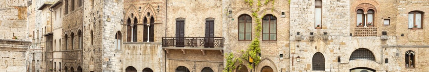 Fototapeta na wymiar long panorama of windows in Tuscany houses in Italy